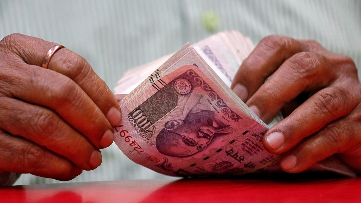 Rupee falls 14 paise to hit record low of 87.57 against U.S. dollar in early trade