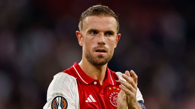 Ajax's Jordan Henderson applauds to supporters at the end of the Europa League soccer match between Ajax and Besiktas, at the Johan Cruyff ArenA, in Amsterdam, Netherlands, Thursday, Sept. 26, 2024. (AP Photo/Maurice van Steen)