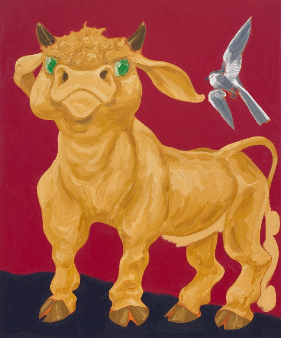 a light brown bull with green eyes stands tall with a gray bird flying to the right on a deep red background