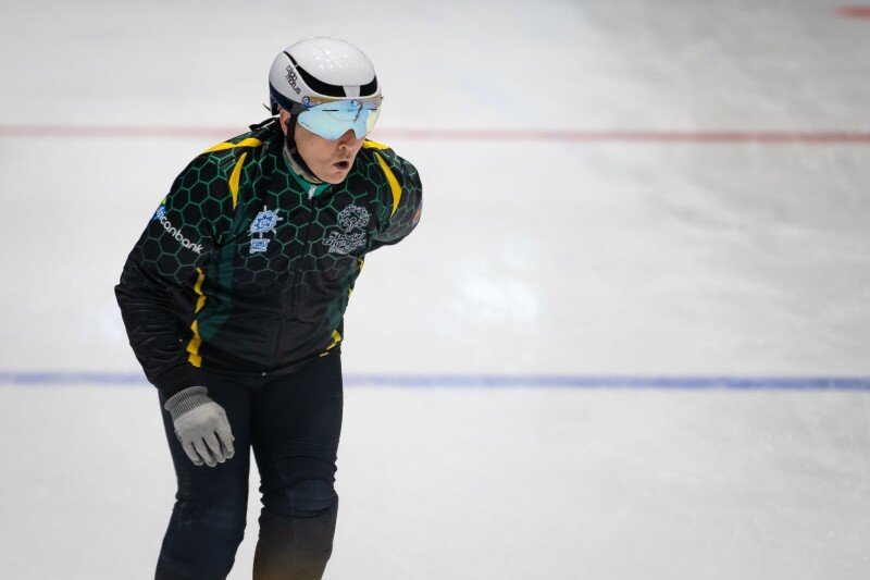 Short track speed skater preparing for a race.