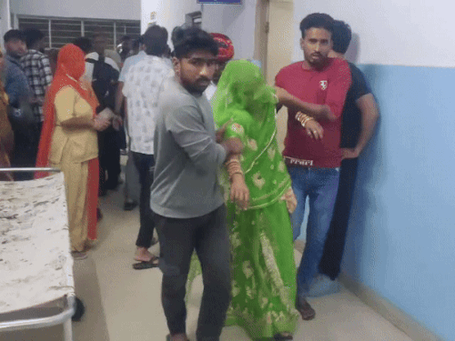 People bringing the woman injured in a horrific accident to the hospital.
